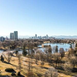 drone photo of park with denver skyline in background